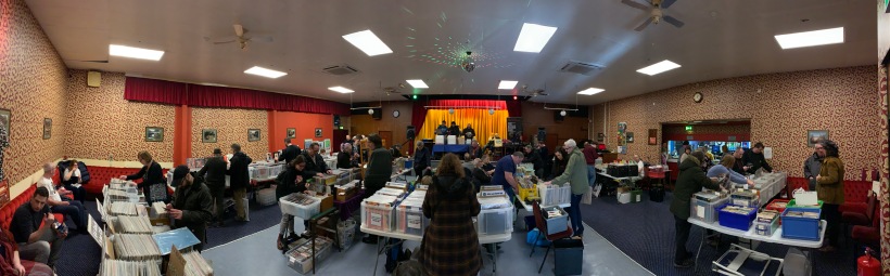 Photo of people crate digging vinyl records